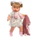 Llorens: Jokajoča dojenčka Alexandra, visoka 42 cm, s cucljem, v roza pleteni jakni in cvetličnem krilu.