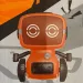 RC interaktivni TalkBot robot z načinom delovanja walkie-talkie v oranžni barvi 2,4 GHz
